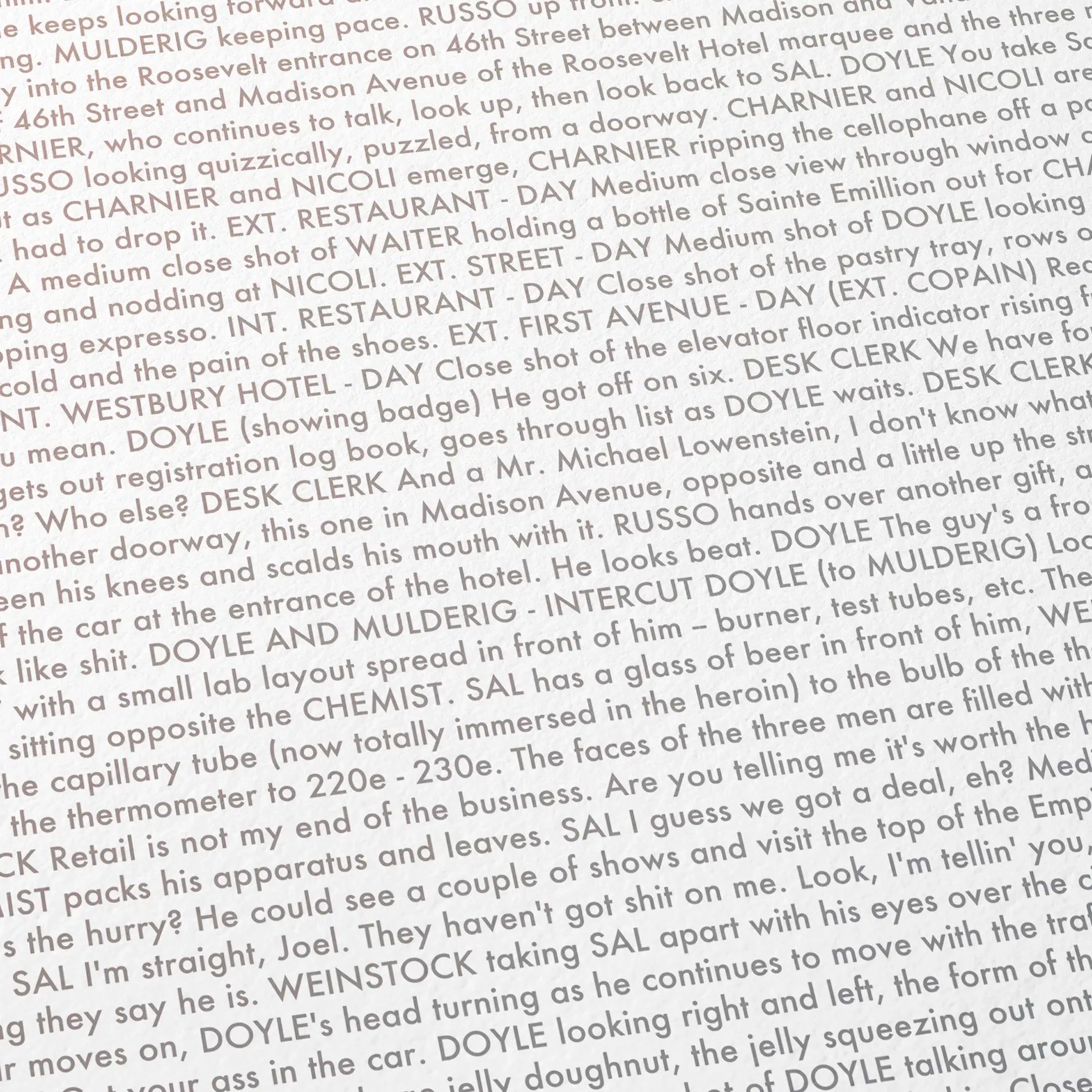 Close-up detail of the The French Connection movie script poster showing dense typographic text.
