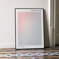 A framed The French Connection movie script poster leaning against a wall in a minimalist interior.