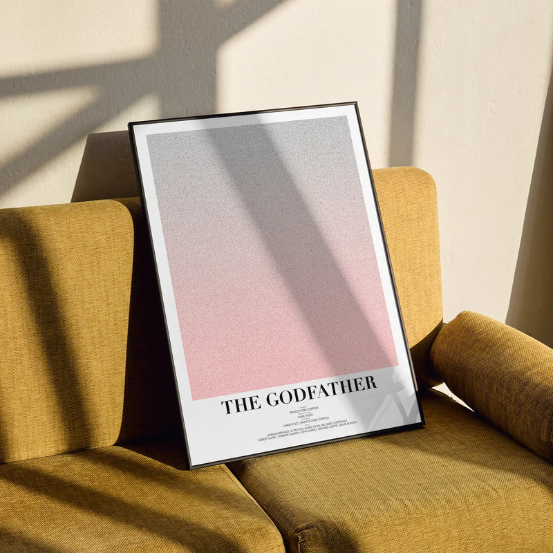 A framed The Godfather movie script poster styled in a clean interior setting.