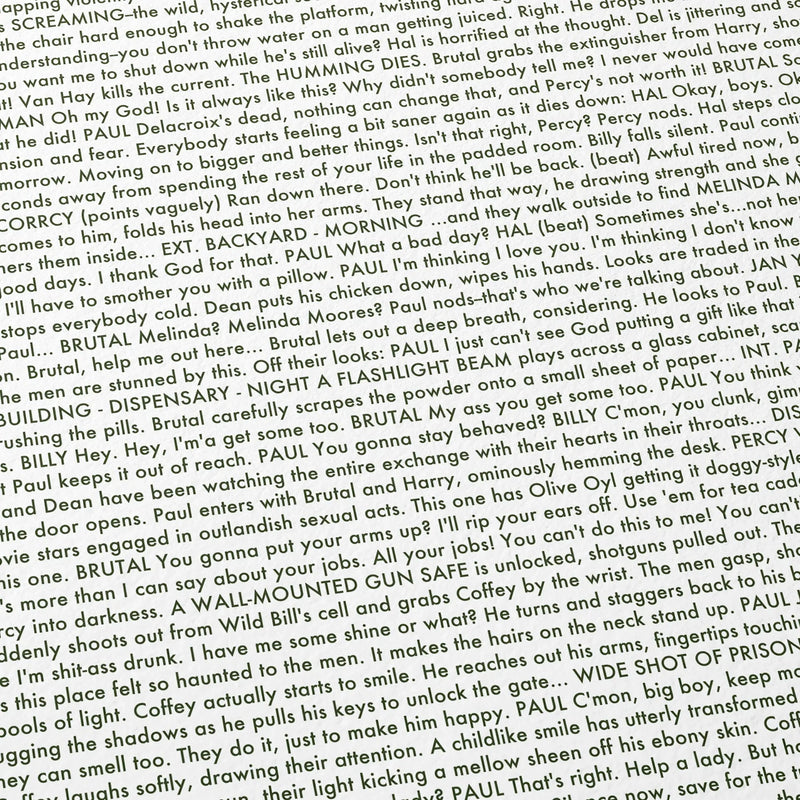 Close-up detail of the The Green Mile movie script poster showing dense typographic text.