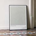 A framed The Green Mile movie script poster leaning against a wall in a minimalist interior.