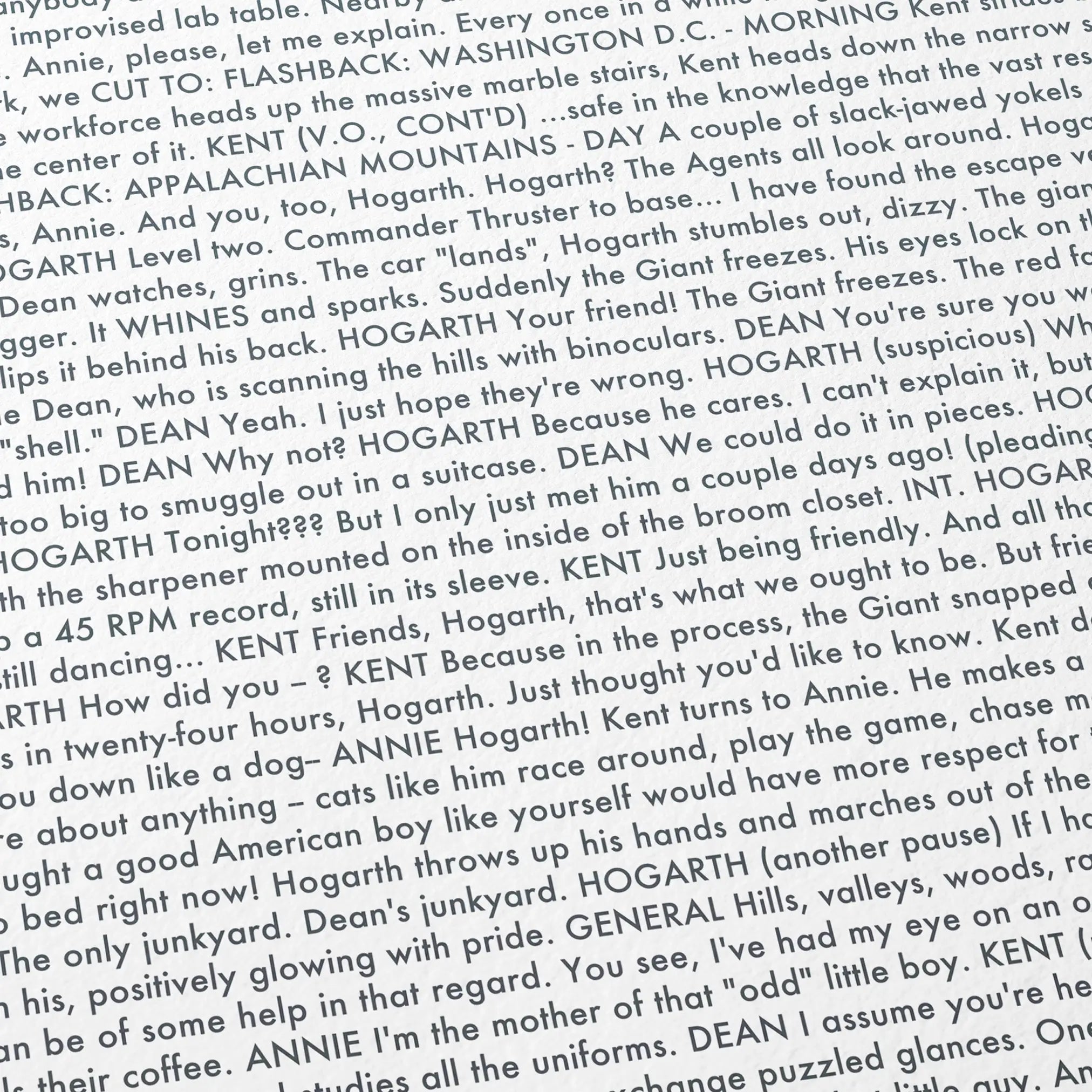 Close-up detail of the The Iron Giant movie script poster showing dense typographic text.