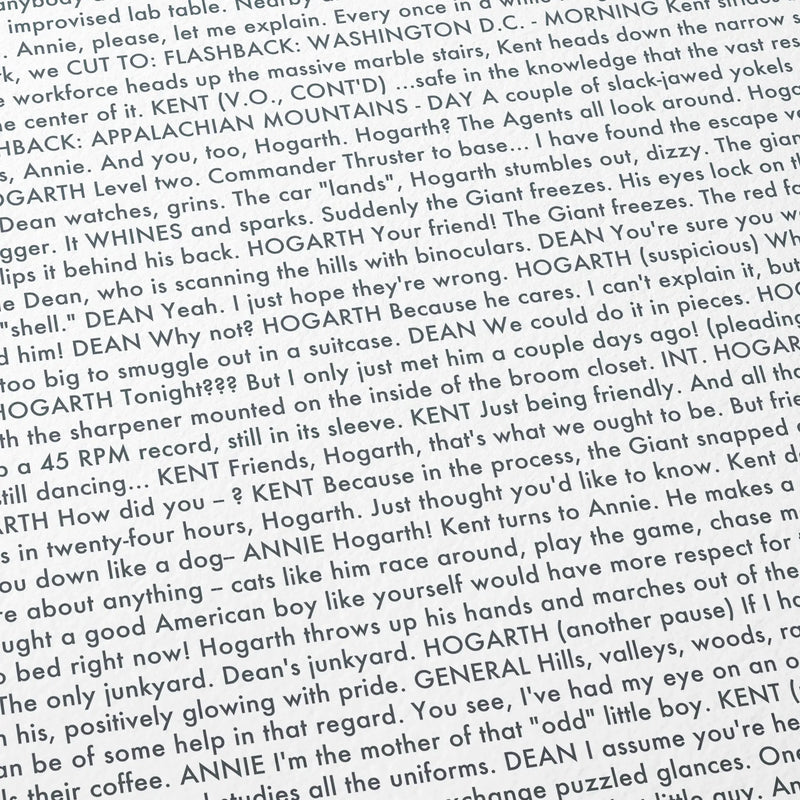 Close-up detail of the The Iron Giant movie script poster showing dense typographic text.