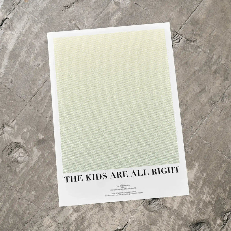 A The Kids Are All Right movie script poster laid flat on a textured floor surface.