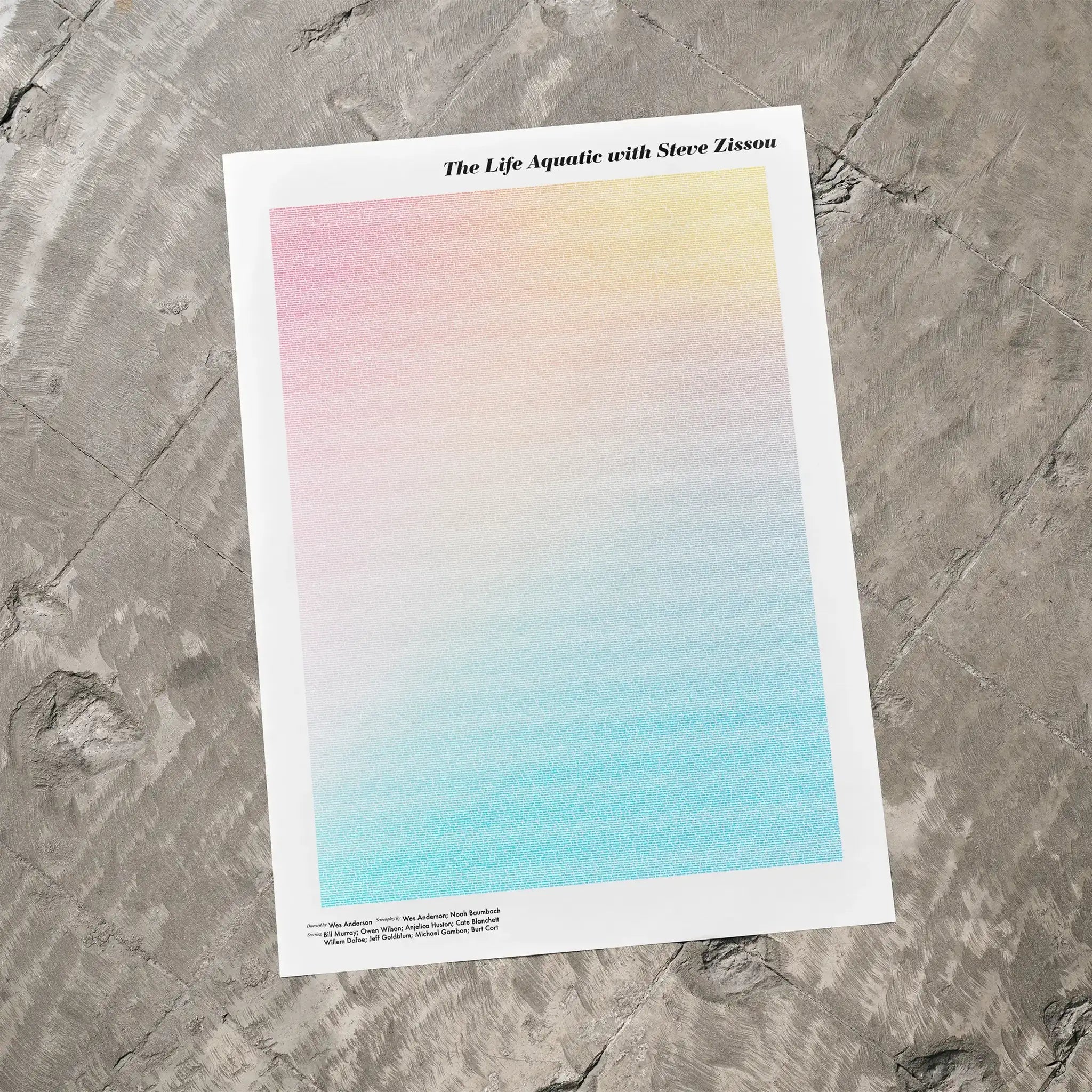 A The Life Aquatic with Steve Zissou movie script poster laid flat on a textured floor surface.