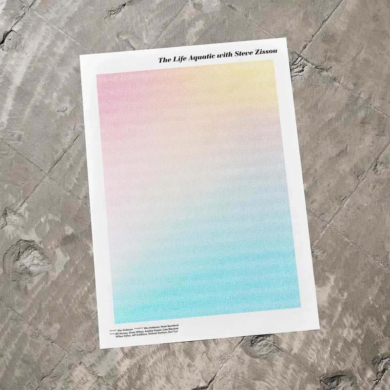 A The Life Aquatic with Steve Zissou movie script poster laid flat on a textured floor surface.