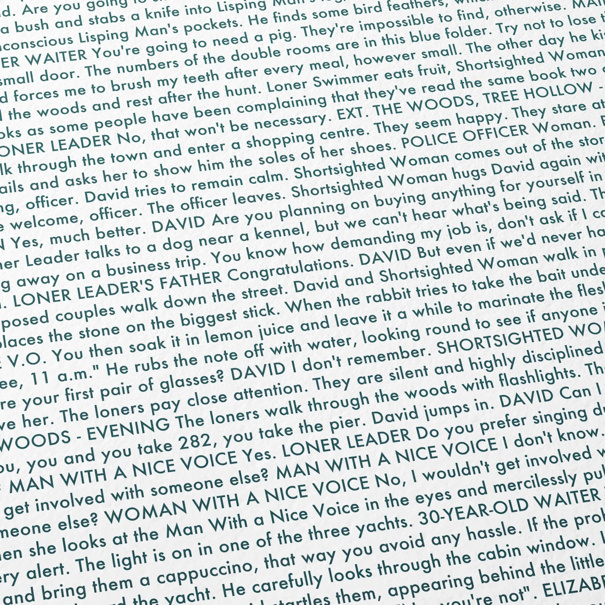 Close-up detail of the The Lobster movie script poster showing dense typographic text.