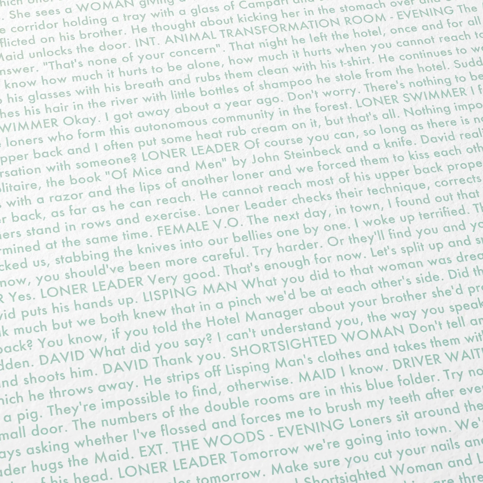 Close-up detail of the The Lobster movie script poster showing dense typographic text.
