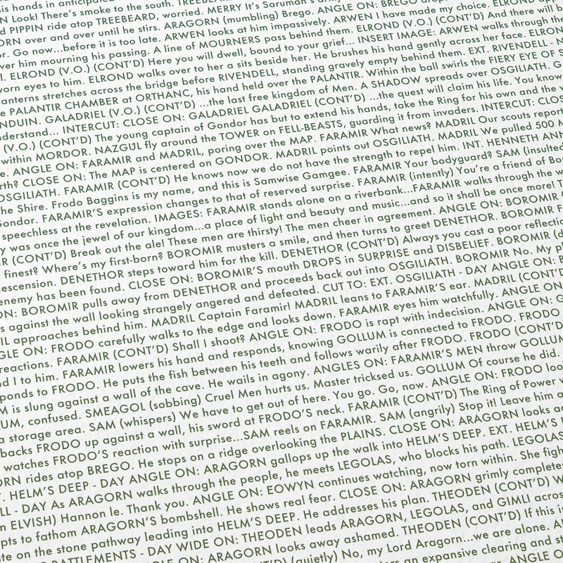 Close-up detail of the The Lord of the Rings: The Two Towers movie script poster showing dense typographic text.