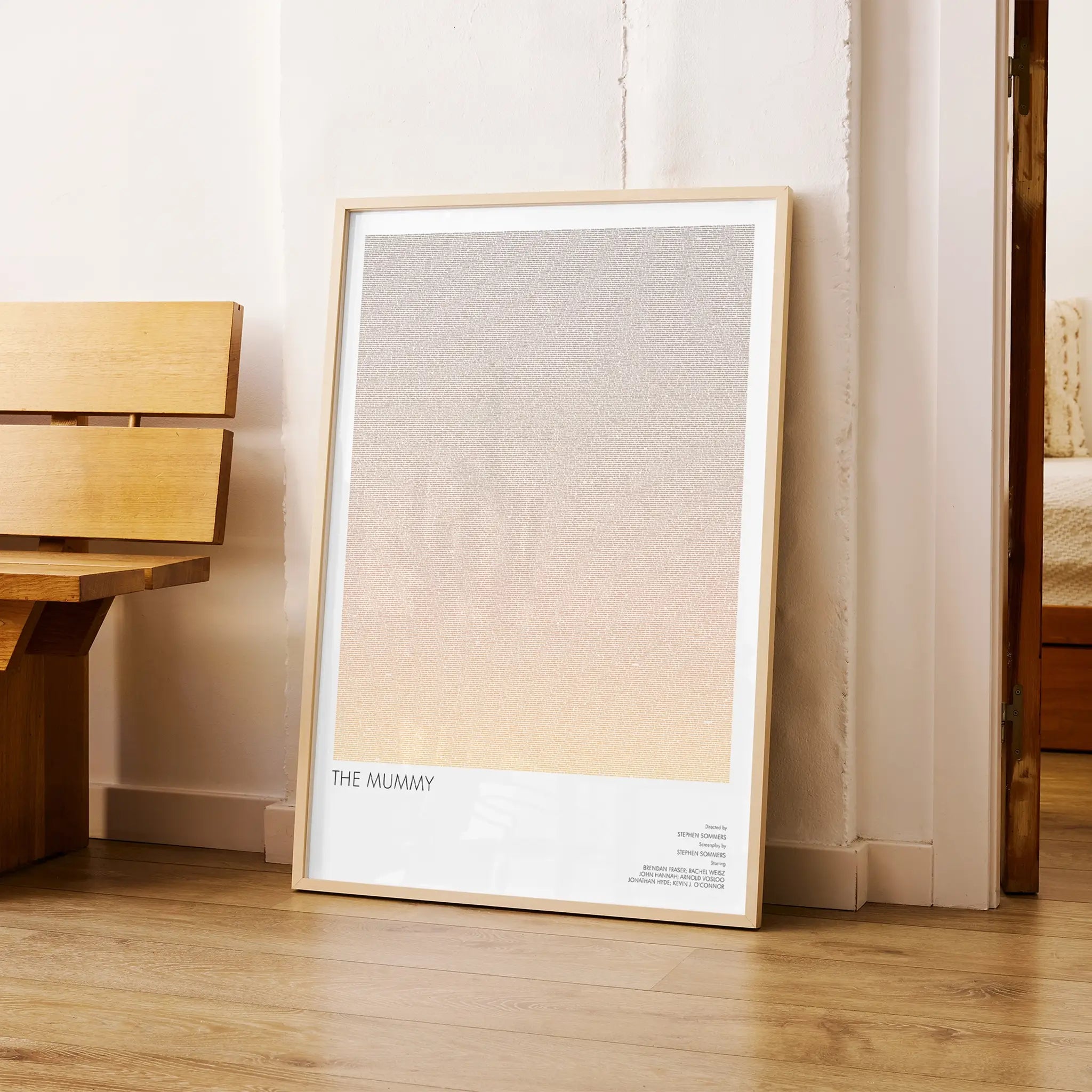 A framed The Mummy movie script poster arranged in a minimalist interior setting.
