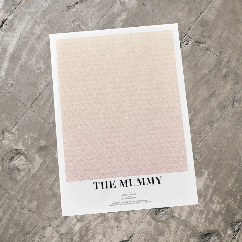 A The Mummy movie script poster laid flat on a textured floor surface.
