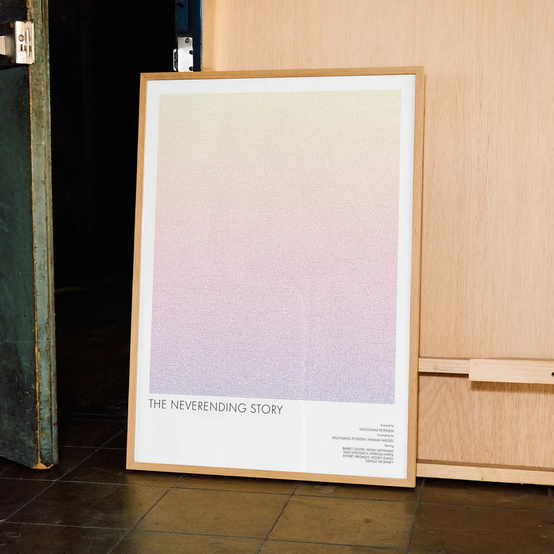 A framed The NeverEnding Story movie script poster displayed in a contemporary interior setting.