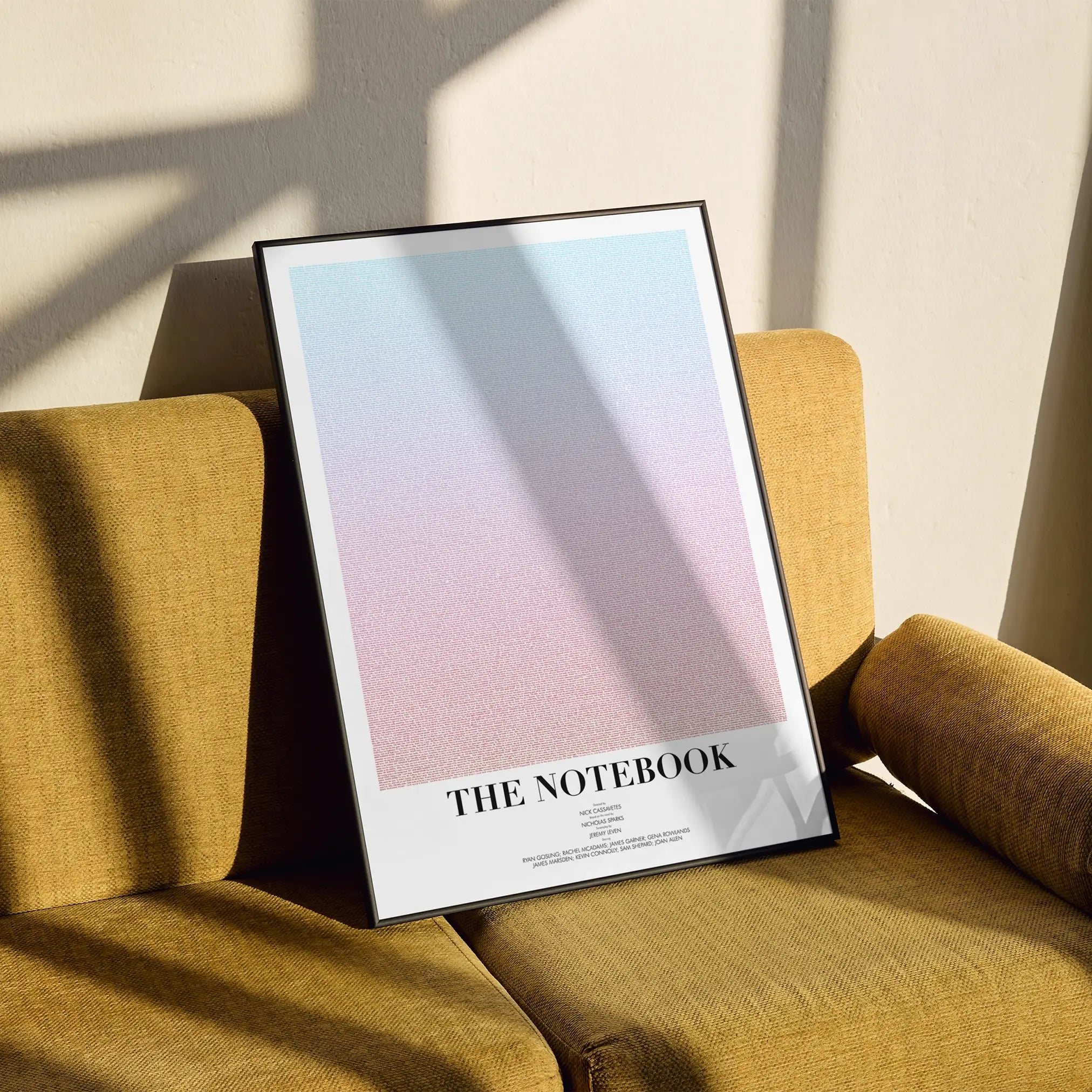 A framed The Notebook movie script poster styled in a clean interior setting.