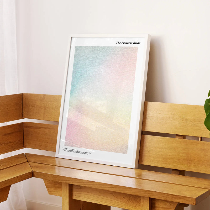 A framed The Princess Bride movie script poster displayed on a sideboard in a contemporary space.