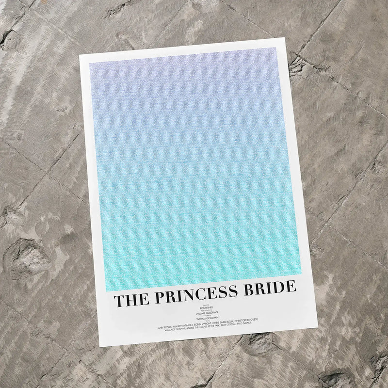 A The Princess Bride movie script poster laid flat on a textured floor surface.
