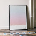 A framed The Producers movie script poster leaning against a wall in a minimalist interior.