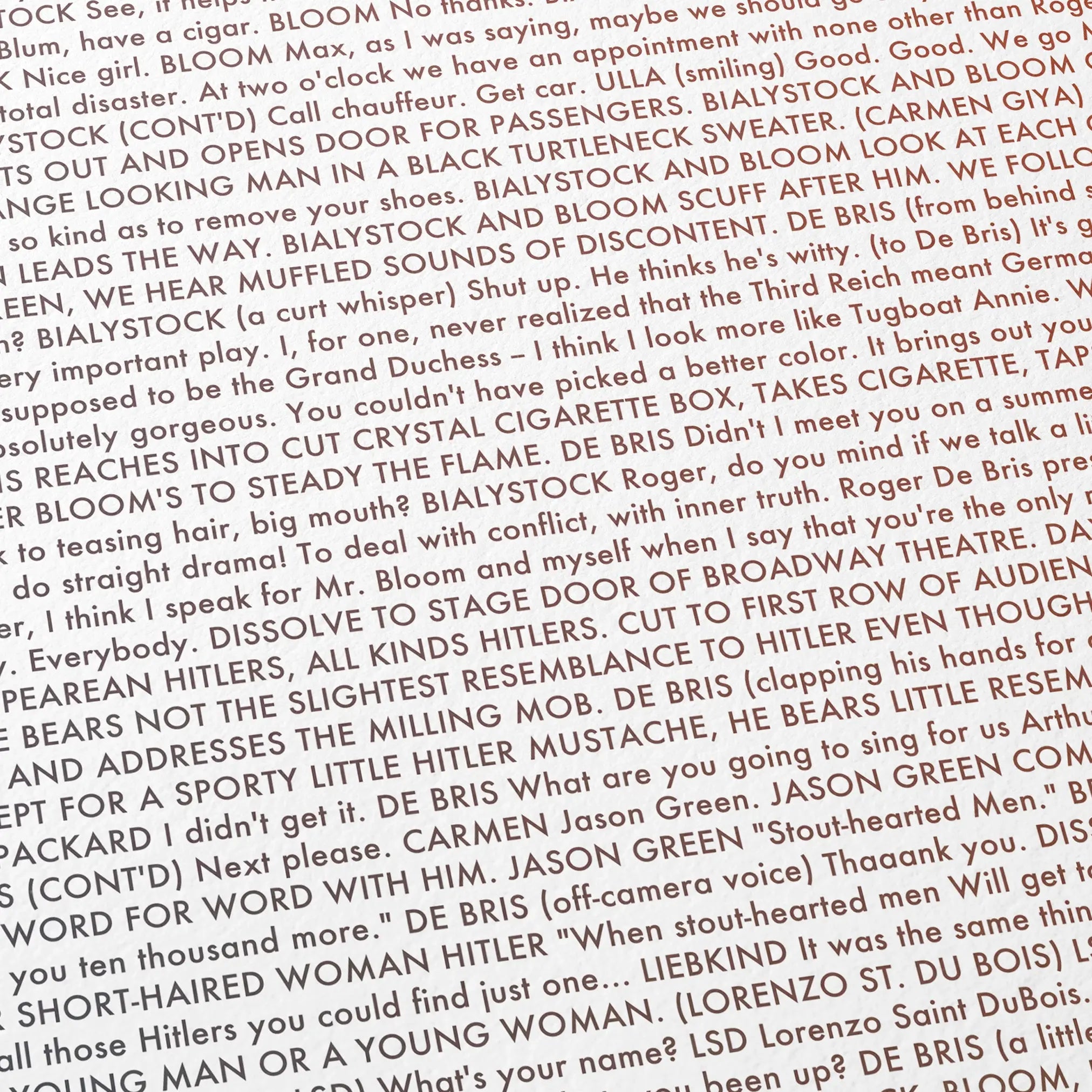 Close-up detail of the The Producers movie script poster showing dense typographic text.