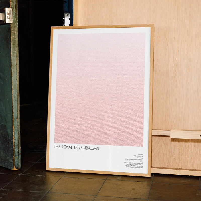 A framed The Royal Tenenbaums movie script poster displayed in a contemporary interior setting.