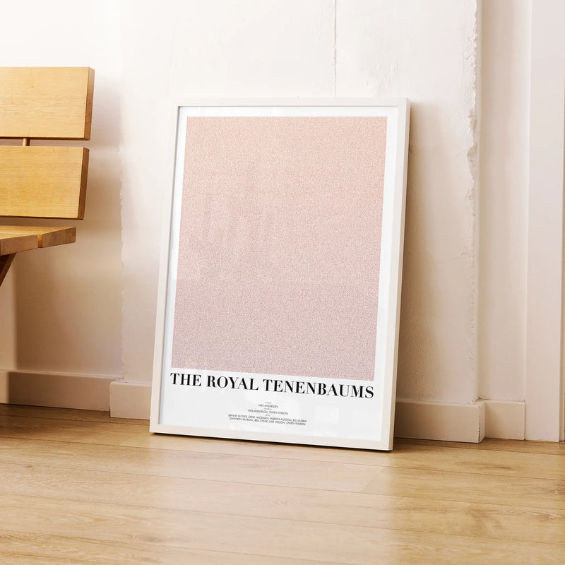 A framed The Royal Tenenbaums movie script poster leaning against a wall in a modern interior.