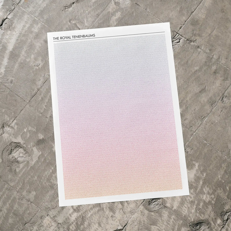 A The Royal Tenenbaums movie script poster laid flat on a textured floor surface.