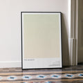 A framed The Sandlot movie script poster leaning against a wall in a minimalist interior.