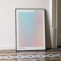 A framed The Social Network movie script poster leaning against a wall in a minimalist interior.