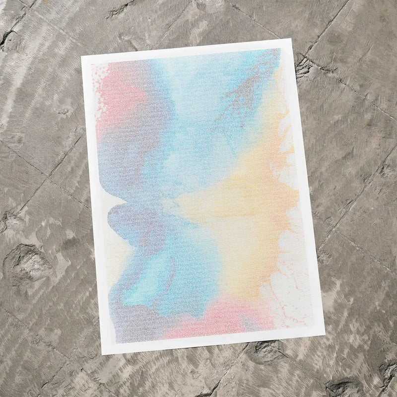 A The Social Network movie script poster laid flat on a textured floor surface.