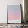 A framed The Terminator movie script poster leaning against a wall in a minimalist interior.