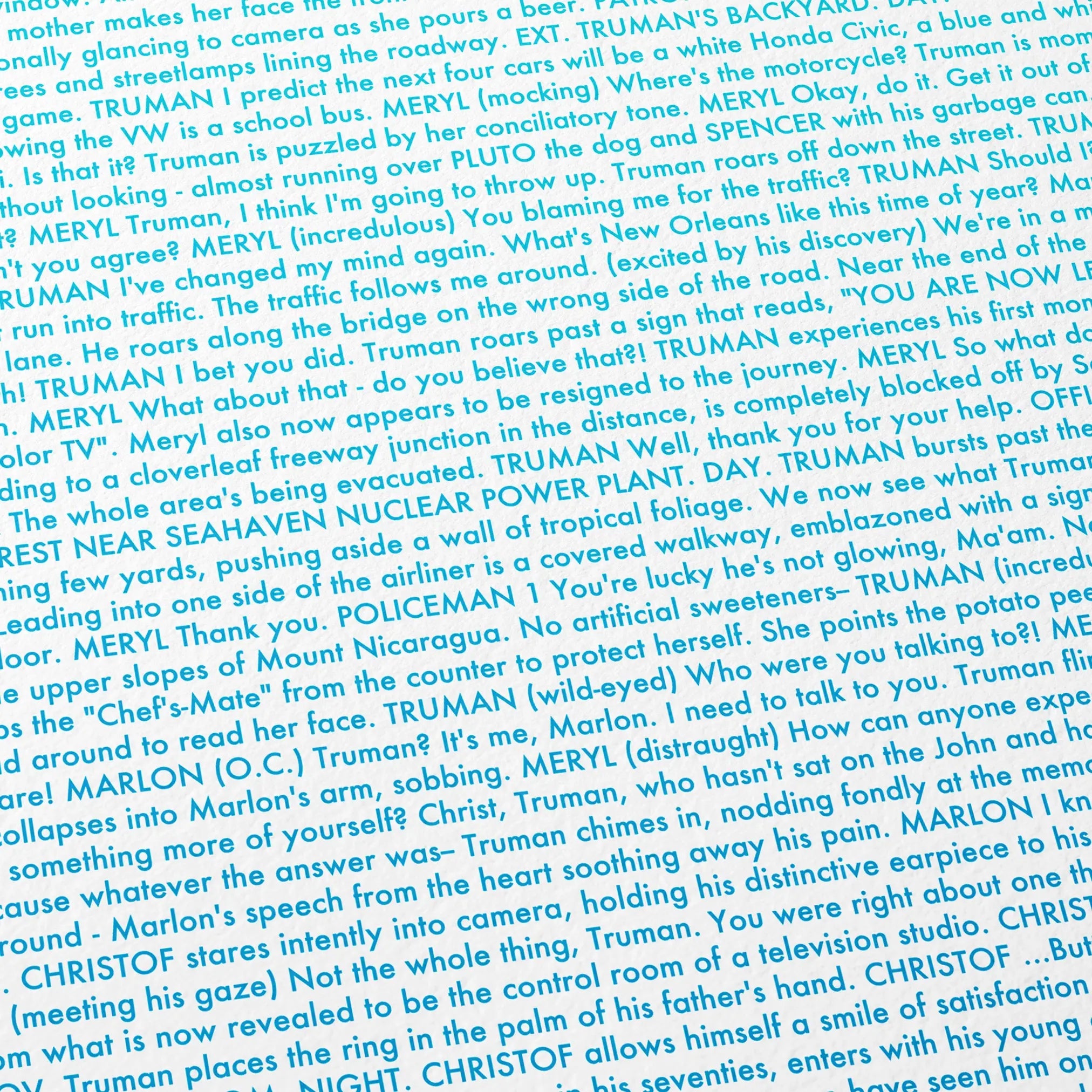 Close-up detail of the The Truman Show movie script poster showing dense typographic text.