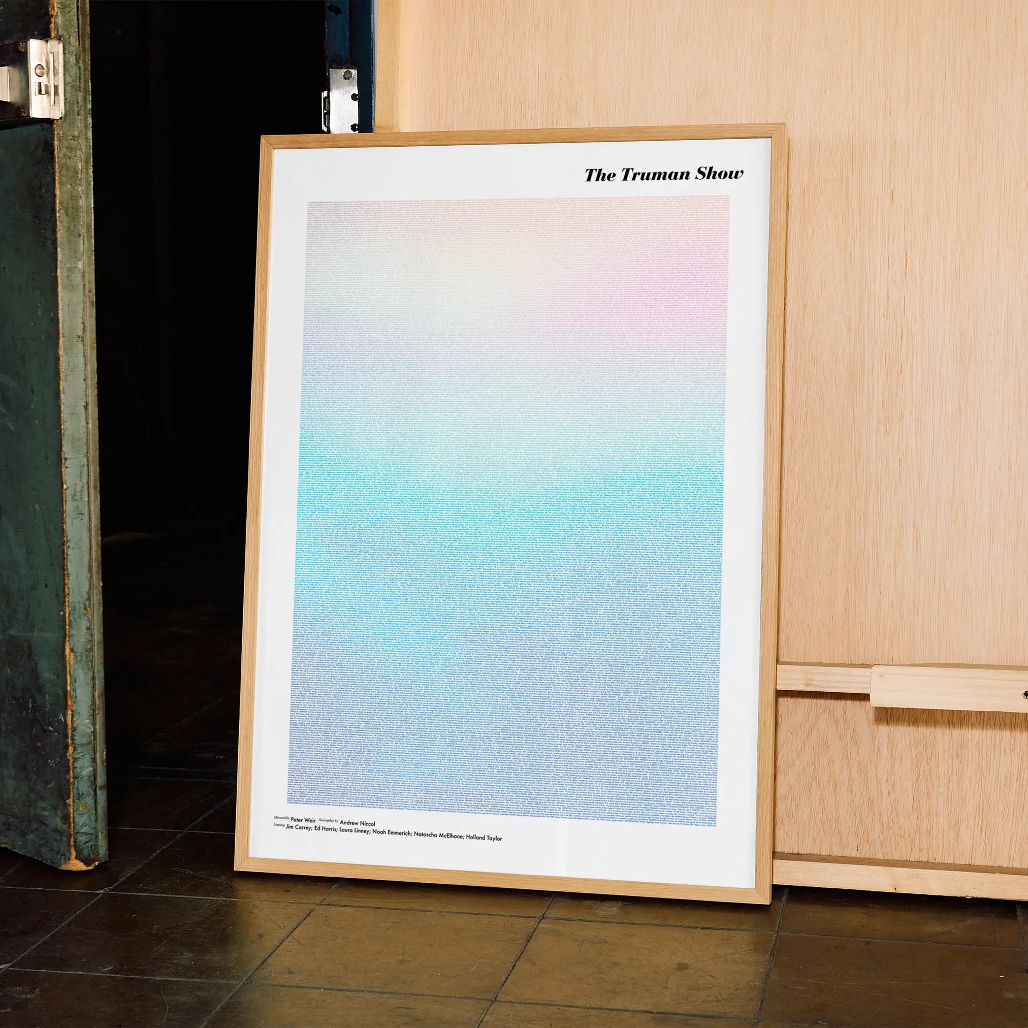 A framed The Truman Show movie script poster displayed in a contemporary interior setting.