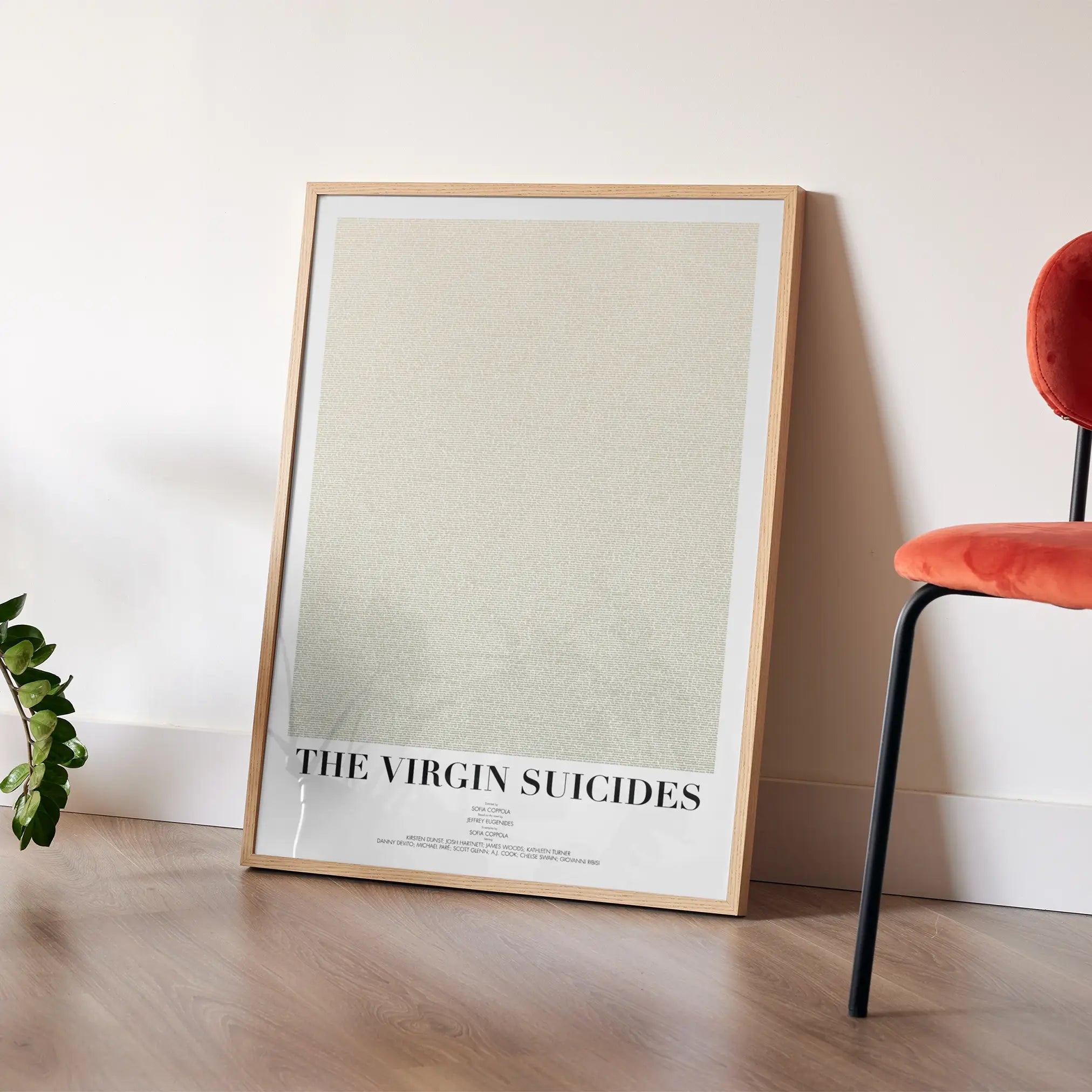 A framed The Virgin Suicides movie script poster placed in a bright interior environment.