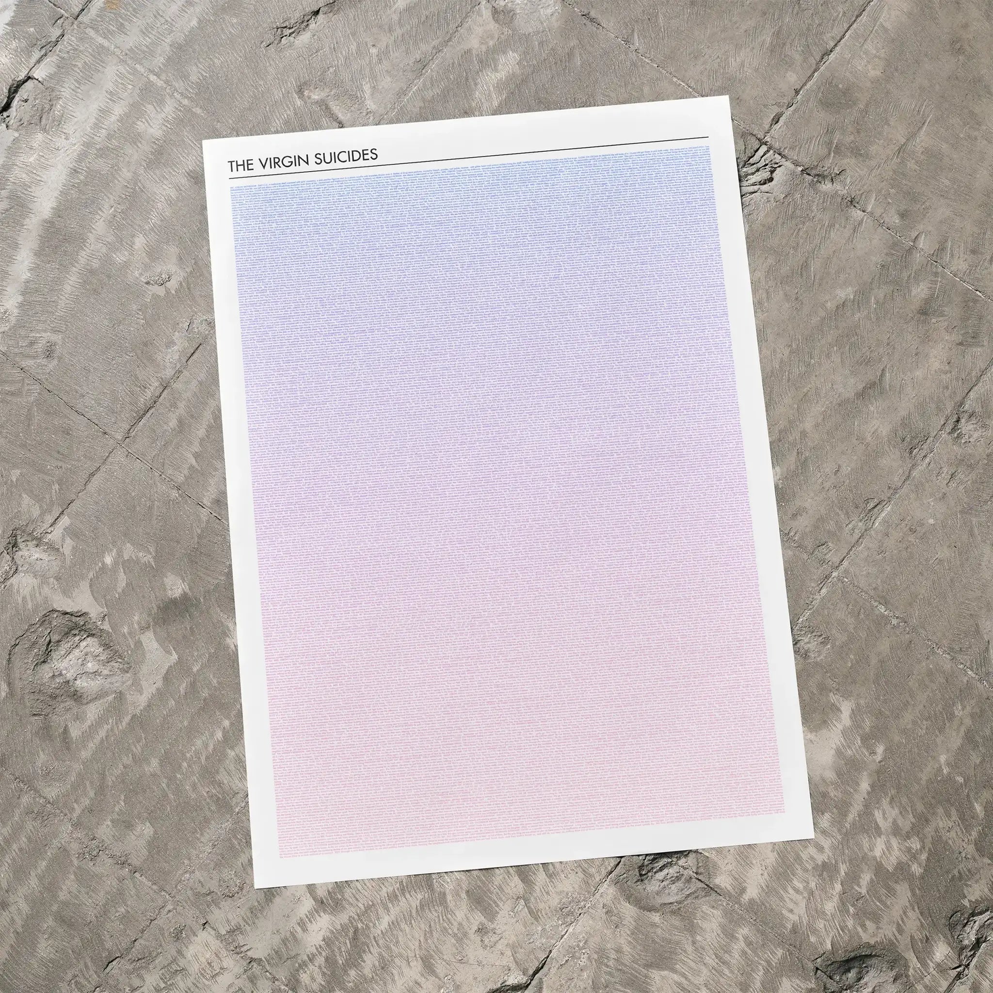 A The Virgin Suicides movie script poster laid flat on a textured floor surface.