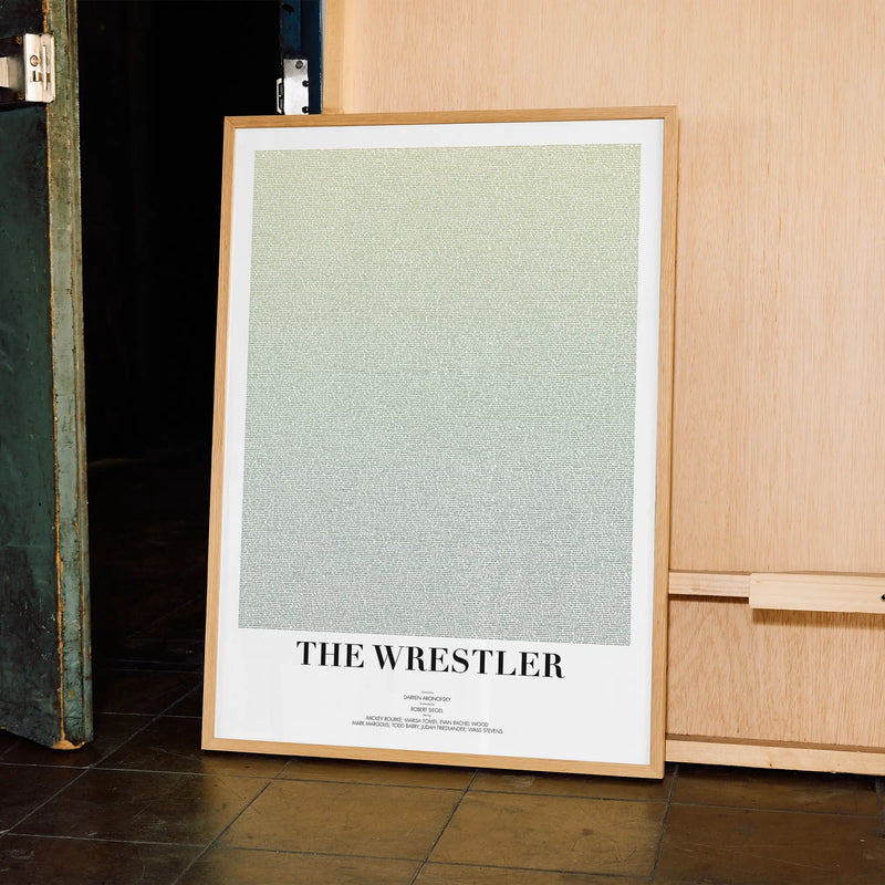 A framed The Wrestler movie script poster displayed in a contemporary interior setting.