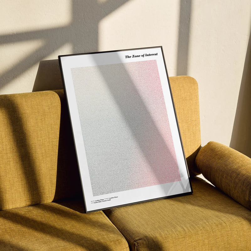 A framed The Zone of Interest movie script poster styled in a clean interior setting.