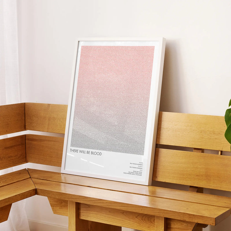 A framed There Will Be Blood movie script poster displayed on a sideboard in a contemporary space.
