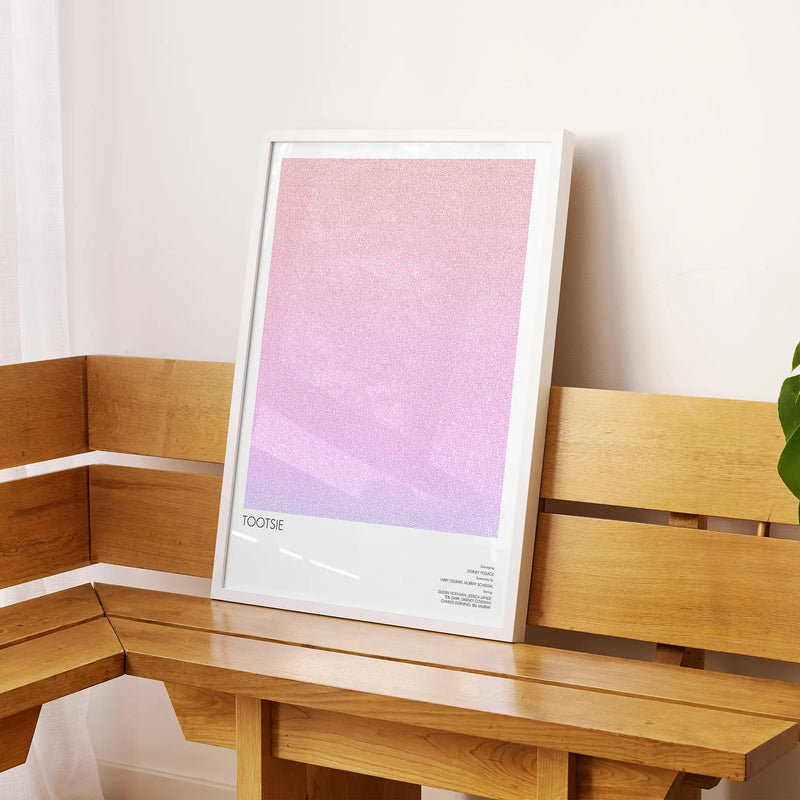 A framed Tootsie movie script poster displayed on a sideboard in a contemporary space.