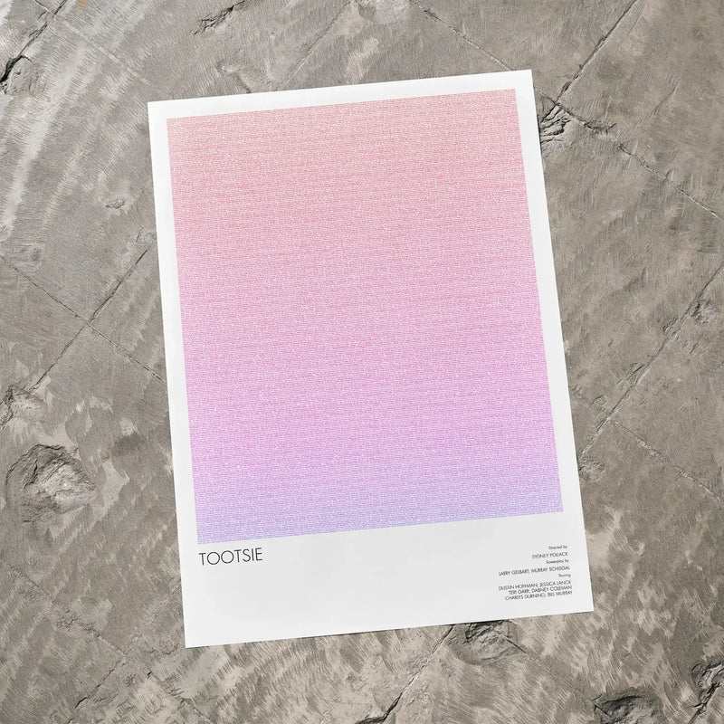 A Tootsie movie script poster laid flat on a textured floor surface.
