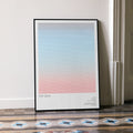 A framed Top Gun movie script poster leaning against a wall in a minimalist interior.
