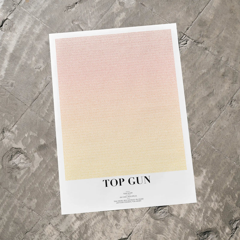 Movie poster for 'Top Gun' on a textured gray surface