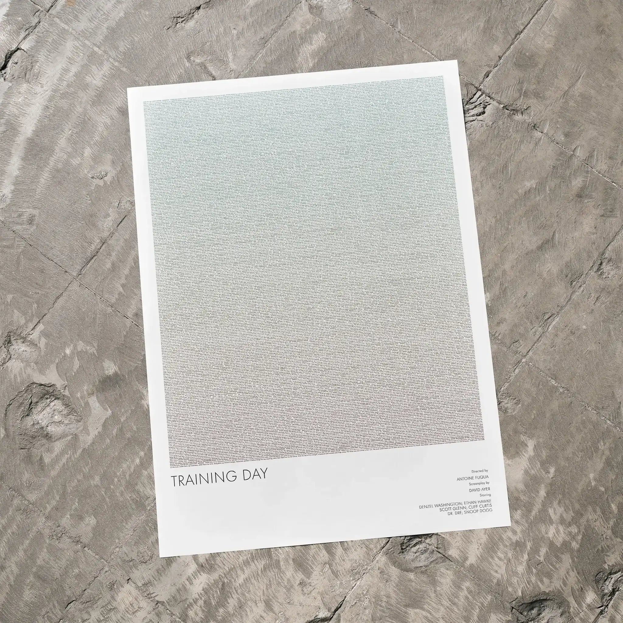 A Training Day movie script poster laid flat on a textured floor surface.