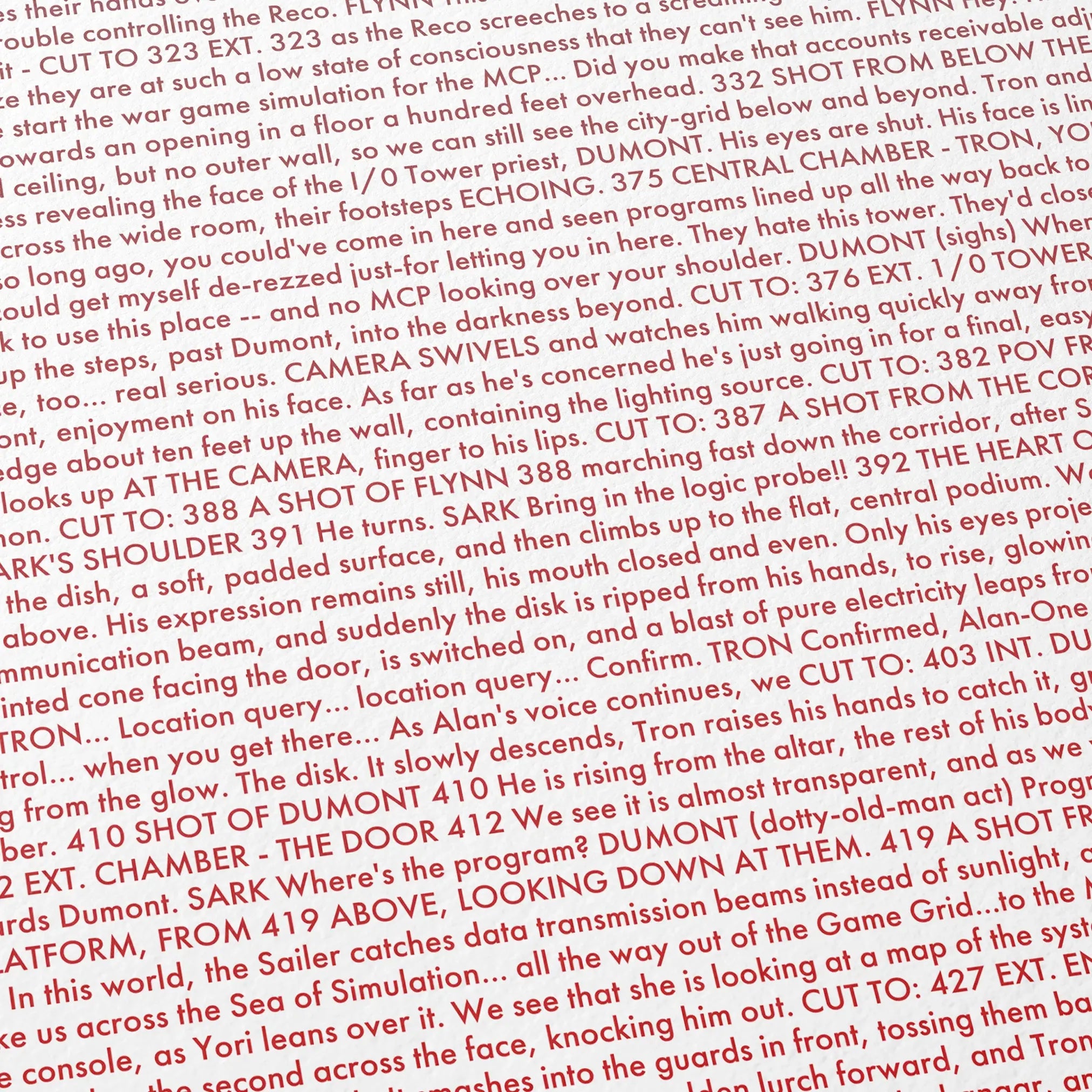 Close-up detail of the Tron movie script poster showing dense typographic text.