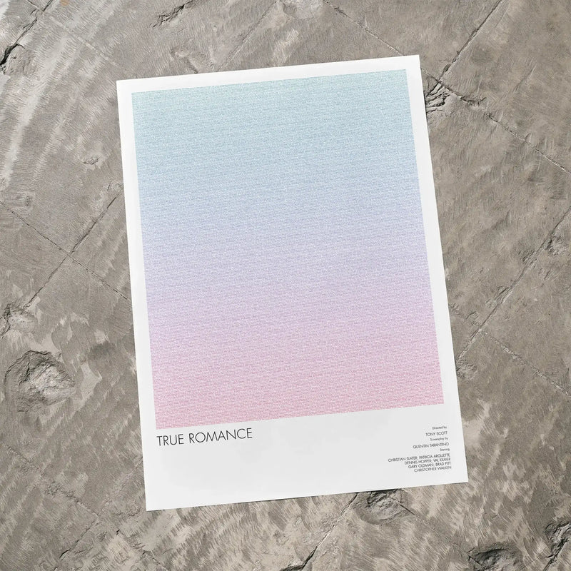 A True Romance movie script poster laid flat on a textured floor surface.