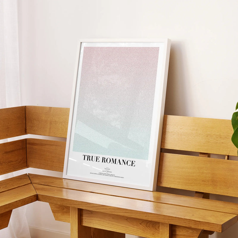 A framed True Romance movie script poster displayed on a sideboard in a contemporary space.