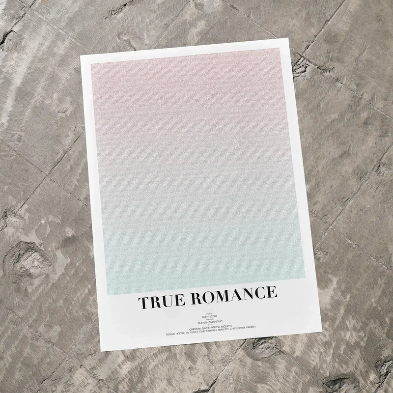 A True Romance movie script poster laid flat on a textured floor surface.