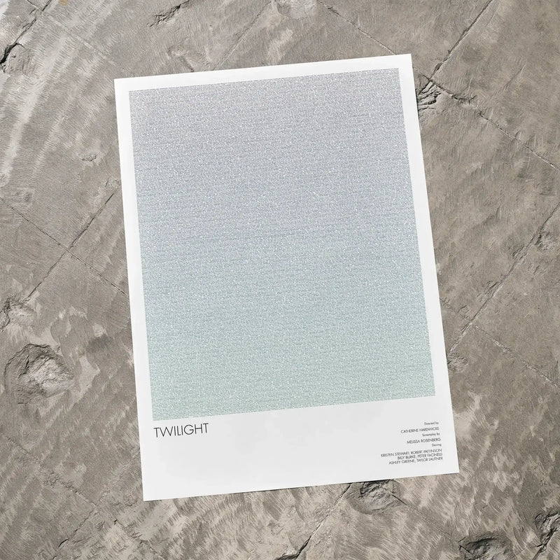 A Twilight movie script poster laid flat on a textured floor surface.