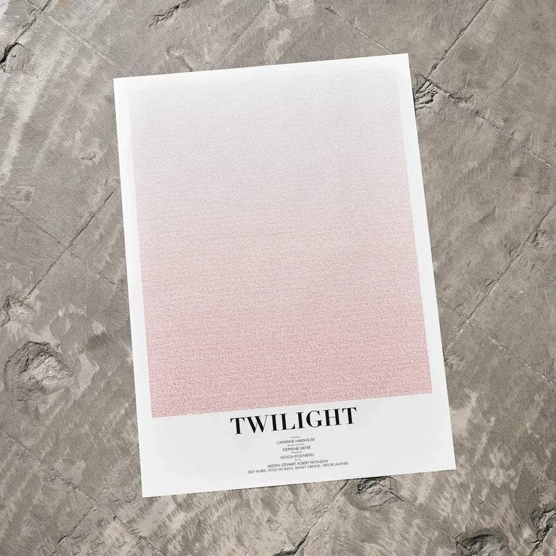 A Twilight movie script poster laid flat on a textured floor surface.