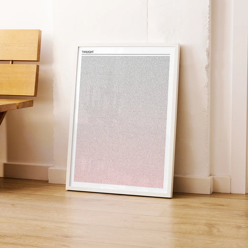 A framed Twilight movie script poster leaning against a wall in a modern interior.