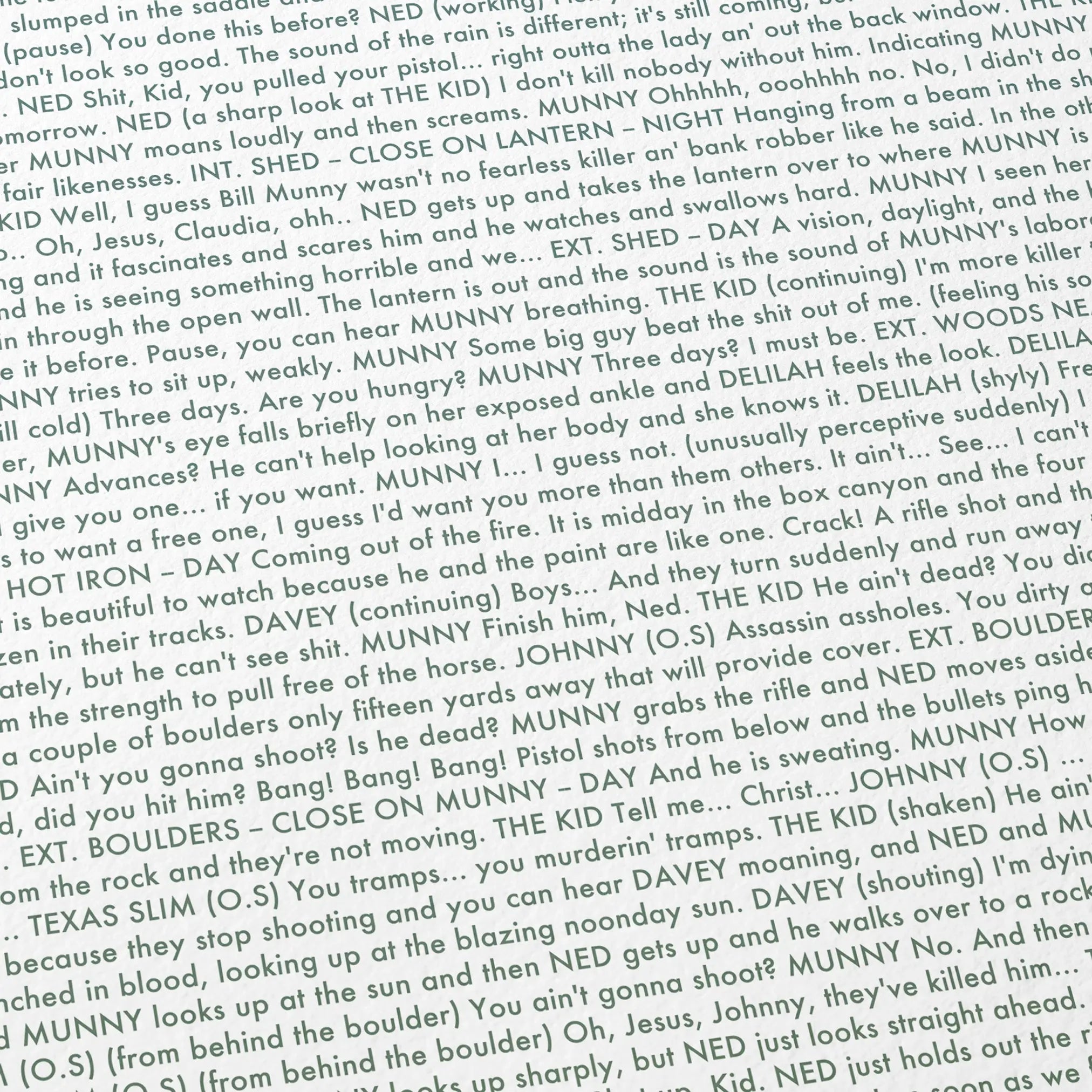 Close-up detail of the Unforgiven movie script poster showing dense typographic text.