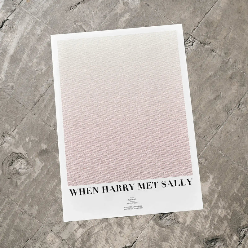 A When Harry Met Sally movie script poster laid flat on a textured floor surface.