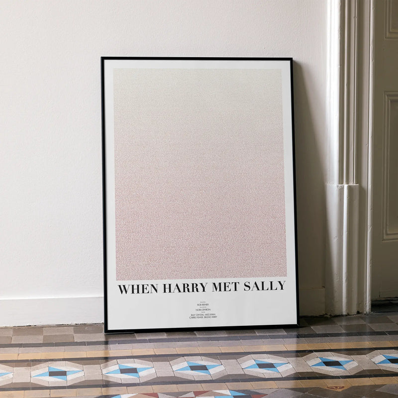 A framed When Harry Met Sally movie script poster leaning against a wall in a minimalist interior.